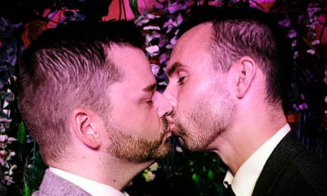 Shane Sweeney and Eoin McCabe kiss after their mock wedding in a Belfast cabaret club. 