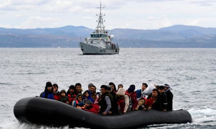 Refugees accompanied by a Frontex vessel arrive on the Greek island of Lesbos, 28 February 2020
