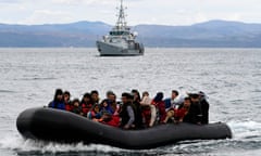 FILE - Migrants arrive with a dinghy accompanied by a Frontex vessel at the village of Skala Sikaminias, on the Greek island of Lesbos, after crossing the Aegean sea from Turkey, on Feb. 28, 2020. European Union lawmakers approved on Thursday, April 20, 2023 a series of proposals aimed at ending the years-long standoff over how best to manage migration, a conundrum that has provoked one of the bloc's biggest political crises. (AP Photo/Michael Varaklas, File)