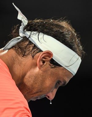 Sweat drips off the nose of Rafael Nadal.