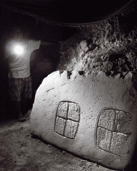 The third hieroglyphic panel discovered at the Mayan ruins in Xunantunich, in western Belize, with Awe holding a flashlight.
