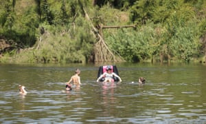 Swimmers escape the heat at the Nepean River Reserve in Sydney.