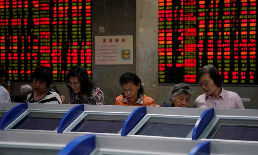 Investors at a brokerage house in Shanghai, China.