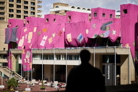 Ibrahim Mahama looks at his installation Purple Hibiscus, at Barbican Lakeside Terrace, London.