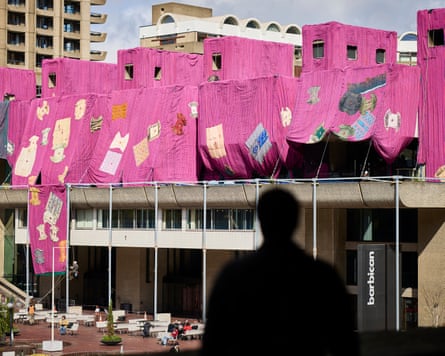 Parts of the Barbican draped in pink fabric