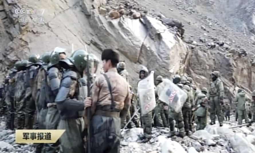 Chinese and Indian troops come face to face along the disputed border between the two countries in June. Beijing admitted for the first time this week that four of its soldiers died in the clashes.