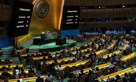 Screens show the vote tally during the UN general assembly vote