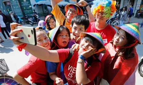 Young people celebrate a Pride event on the streets of Hanoi, Vietnam.
