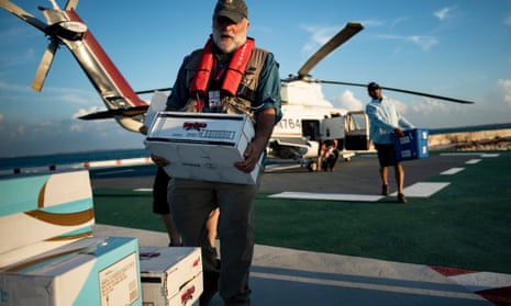 José Andrés carrying a box of food from World Central Kitchen to help survivors of Hurricane Dorian, in the Bahamas, September 2019
