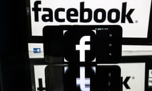 Facebook social networkST PETERSBURG, RUSSIA - NOVEMBER 16, 2016: A smartphone schowing a facebook logo, on a reflective surface in front of a computer screen showing a Facebook sign. Sergei Konkov/TASS (Photo by Sergei Konkov\TASS via Getty Images)