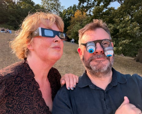 Martin Belam and his partner, Melanie, preparing to watch the solar eclipse from Hampstead Heath in north London.