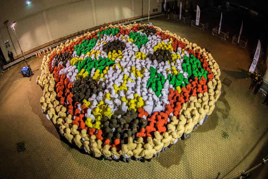 More than 800 Just Eat employees from around the world took part in a challenge to set a new Guinness World Record for the largest human image of a pizza.
