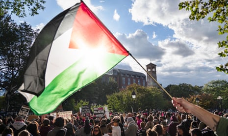 A Palestinian flag flies during a pro-Palestinian rally organized by the NYU Students for Justice in Palestine. Florida is seeking to ‘deactivate’ SJP.