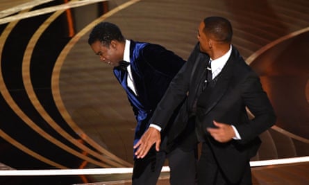 Will Smith (R) slaps Chris Rock onstage during the 94th Oscars in Hollywood, California, on 27 March 2022.