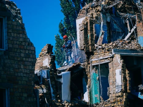 Rescue workers in torn apart building