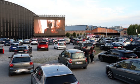 People watch a movie from their cars at an open air cinema event in Brussels, Belgium on 3 July, 2020.