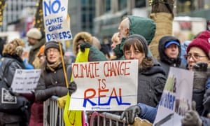 Climate change placards at protest against Trump’s cabinet picks, New York, USA - 09 Jan 2017