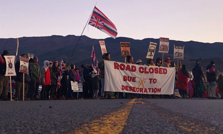 Demonstrators block a road at the base of Hawaii’s tallest mountain, on 15 July.