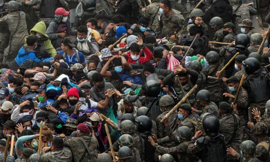 Guatemalan soldiers and police beat a group of Honduran migrants, in a road near to Chiquimula, Guatemala, 17 January 2021.