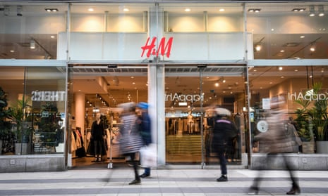 Shoppers in front of a H&M store in Hong Kong