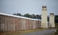 The razor-topped walls and watchtowers of the former Maze prison.