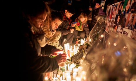 People in Toronto light candles in memory of those killed when an Iranian missile brought down Ukraine Airlines flight 752 just after takeoff from Tehran
