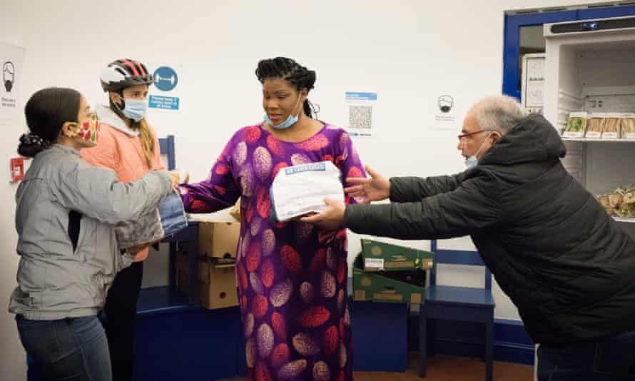 Girija Tase, 27 and Alex Brickman, 28, collect leftover food from Greggs in Brixton to deliver to a homeless outreach centre at Chandler Community Hall