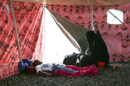 A cholera patient is treated in a tent