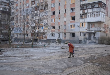 A local resident walks an empty street in the city of Bakhmut.