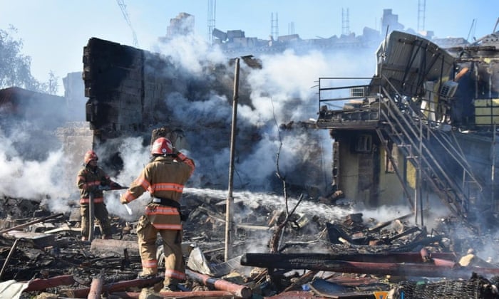 Firefighters work at the site of a Russia missile strike in Zatoka, Odesa region, Ukraine on 26 July.