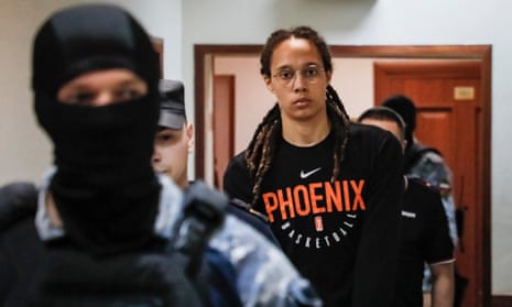 Phoenix Mercury player Brittney Griner is escorted to a courtroom for a hearing at the Khimki city court outside Moscow.