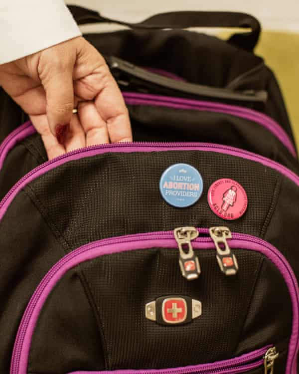 backpack with pins on it.  One says 
