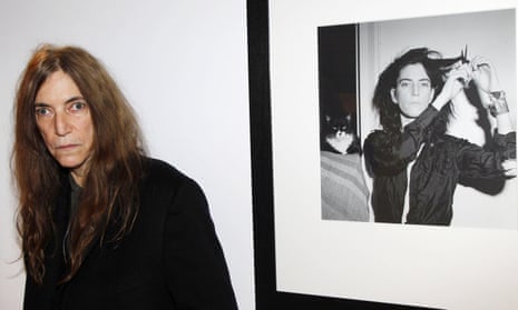 Patti Smith with a portrait of her by her friend Robert Mapplethorpe.