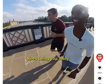 Burnham running alongside Mo Farah