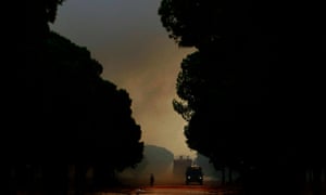 Firefighters try to extinguish the fire as it reaches Donaña national park.