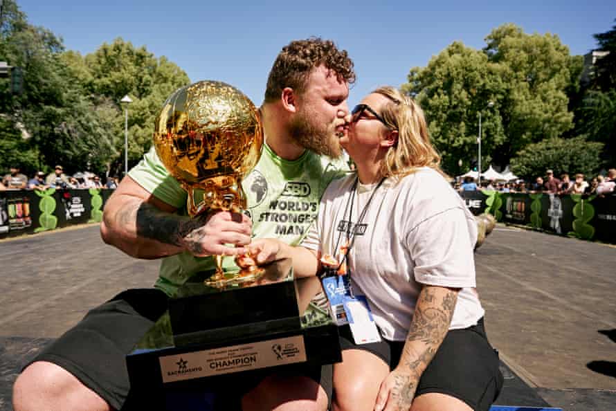 Stoltman kisses woman