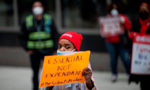 A nurse attends a protest, organized by the New York State Nurses Association (NYSNA) in front of the National Holdings Corporation today in New York City. The nurses protested because congress granted bailouts to corporations and Wall Street billionaires, but not enough for the communities hit hardest by the crisis.