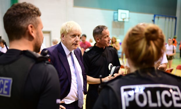 Prime Minister Boris Johnson meets rescue crews and residents