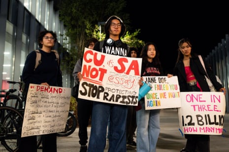 people hold signs outside
