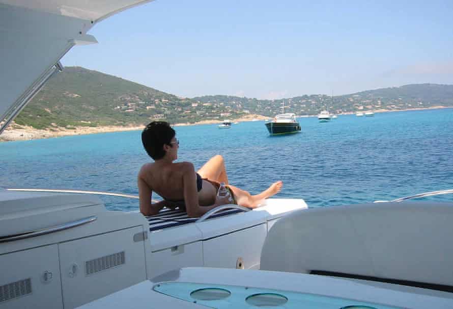 Ghislaine Maxwell relaxing on a yacht.