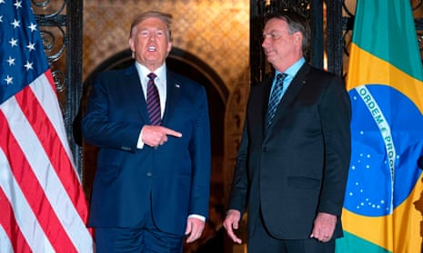 Donald Trump speaks with Jair Bolsonaro during a dinner attended by the then presidents at Mar-a-Lago in Palm Beach, Florida, on 7 March 2020.