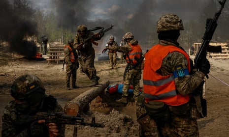 Ukrainian servicemen attend an exercise near the border with Belarus in Rivne region