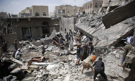People search for survivors amid the rubble of houses destroyed in a Saudi-led airstrike in Sana’a. 