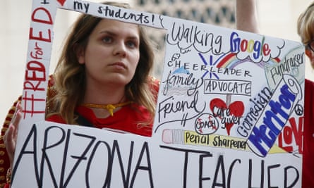 Striking teacher Taylor Dutro listens at the Arizona Capitol on 1 May in Phoenix. The teachers’ union strongly back Saves Our Schools effort to overturn the voucher law.