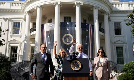 President Joe Biden and first lady Jill Biden are flanked by U.S. Vice President Kamala Harris and her husband Doug Emhoff following an event to celebrate the enactment of the “Inflation Reduction Act of 2022,” which Biden signed into law in August, on the South Lawn at the White House in Washington.