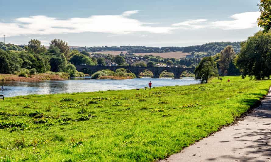 Man on bank of River Dee
