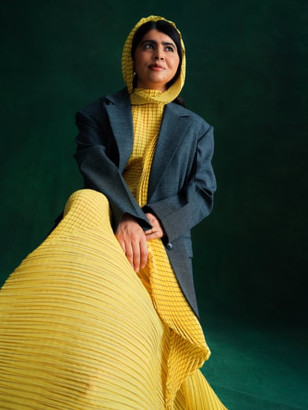 Blazer: Sandro; Dress: Issey Miyake; Earrings: Alighieri