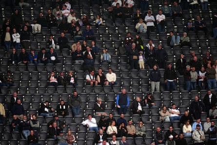 Empty seats in the stands after Tottenham fans leave early.