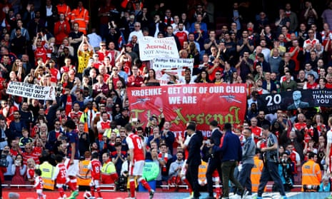 Arsenal supporters hold up banners targeting Stan Kroenke and Arsène Wenger at the home game against Everton, the final match of the league season.