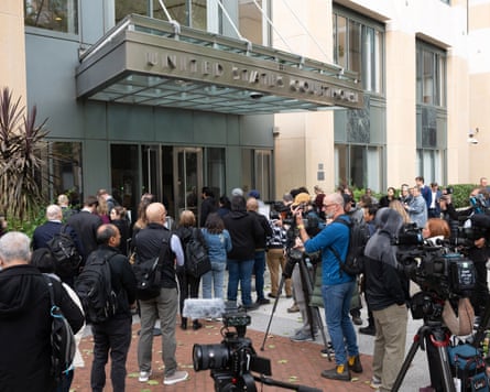 Attorneys and media cluster at the entrance of the Ronald V. Dellums U.S. Courthouse in Oakland, California, on April 27, 2026, for the start of the Elon Musk vs. OpenAI trial.